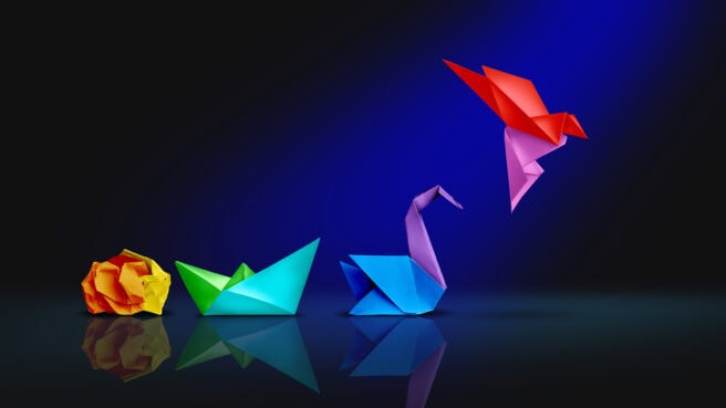 Transform and success or changing to succeed concept and leadership in business through innovation and evolution of ability as a crumpled paper transforming into a boat then a swan and a flying bird as a metaphor.